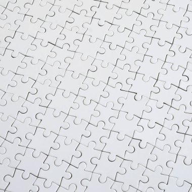 Beyaz jigsaw bulmaca monte durumda doku kapatın. Üstten Görünüm. Büyük bir bütün mozaik birçok bileşenleri birleştirilmiştir