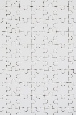 Beyaz jigsaw bulmaca monte durumda doku kapatın. Üstten Görünüm. Büyük bir bütün mozaik birçok bileşenleri birleştirilmiştir