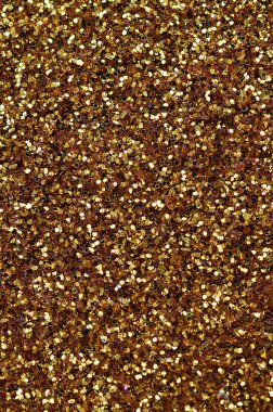 Sarı dekoratif payetler büyük miktarda. Arka plan doku ışık rasgele bir sırada yansıtmak, küçük parlak elemanları ile. Glitter doku