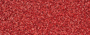 Kırmızı dekoratif payetler büyük miktarda. Arka plan doku ışık rasgele bir sırada yansıtmak, küçük parlak elemanları ile. Glitter doku