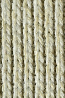 Kumaş dokusu yumuşak sarı örme kazak. Görüntüyü iplikler bağlarında yapısı