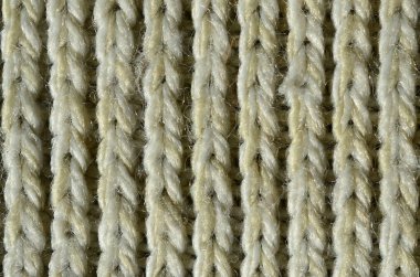 Kumaş dokusu yumuşak sarı örme kazak. Görüntüyü iplikler bağlarında yapısı