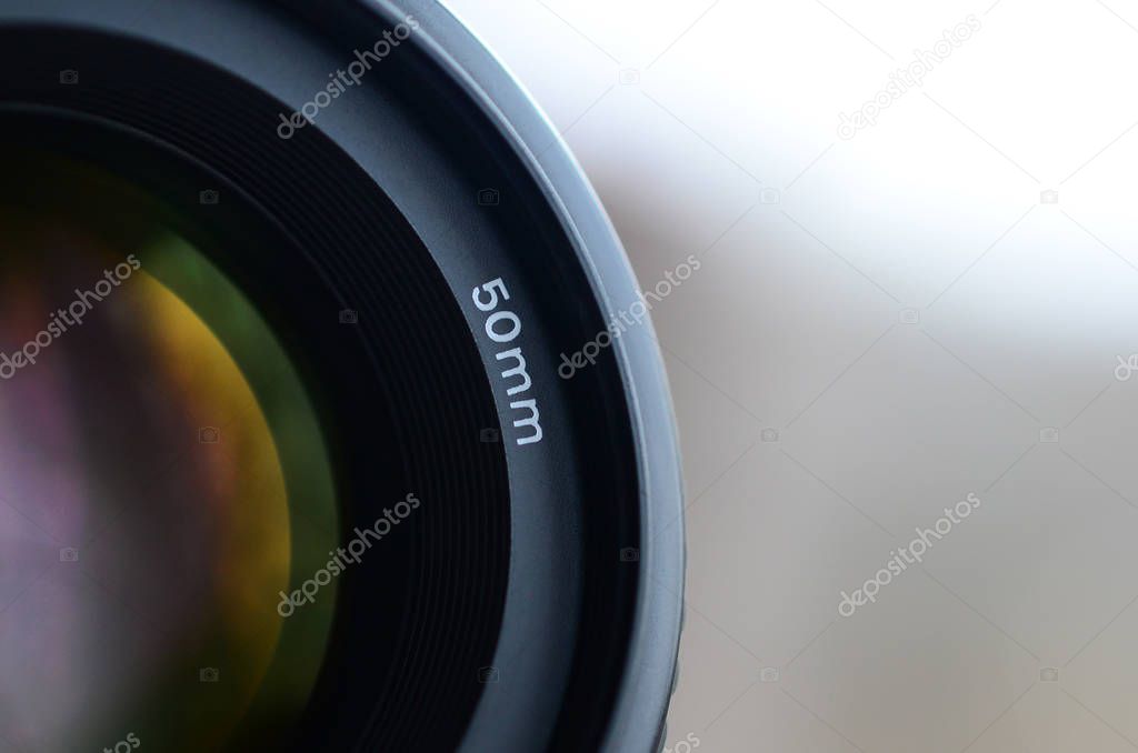 Fragment of a portrait lens for a modern SLR camera. A photograph of a wide-aperture lens with a focal length of 50mm