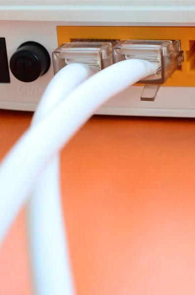 The Internet cable plugs are connected to the Internet router, w — Stock Photo, Image