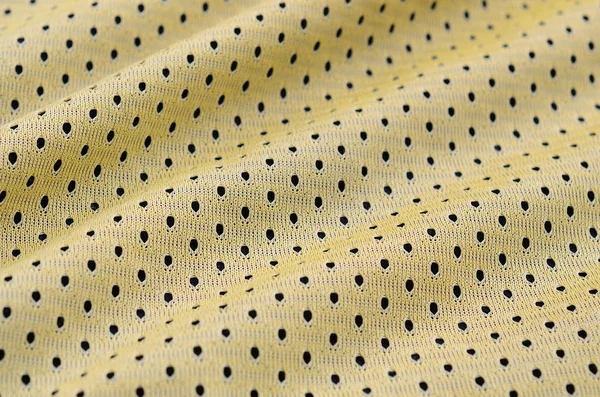 黄色のスポーツ ジャージ服の生地テクスチャと背景 — ストック写真