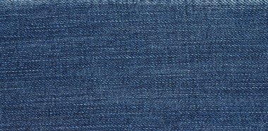 Kotun kumaş arka planı. Eski moda kot pantolonlar. Arkaplan ve dokunun yakın plan kotu