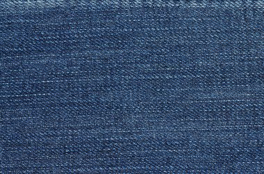 Kotun kumaş arka planı. Eski moda kot pantolonlar. Arkaplan ve dokunun yakın plan kotu