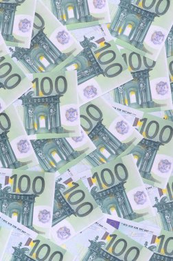 Arka plan deseni yeşil parasal mezhepleri 100 milyon avroluk bir dizi. Bir sürü para sonsuz bir yığın oluşturur