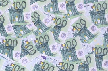 Arka plan deseni yeşil parasal mezhepleri 100 milyon avroluk bir dizi. Bir sürü para sonsuz bir yığın oluşturur