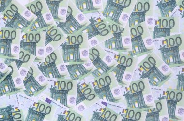 Arka plan deseni yeşil parasal mezhepleri 100 milyon avroluk bir dizi. Bir sürü para sonsuz bir yığın oluşturur