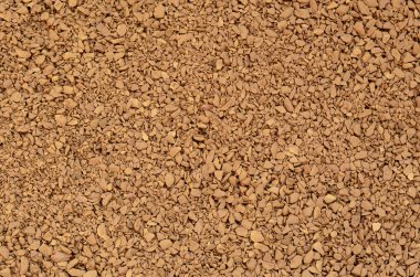 Çekilmiş kahve koyu kahverengi renk birçok küçük çakıl taşları şeklinde dokusuna