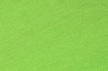Kumaş dokusuna parlak yeşildir. Gömlek ve bluz yapmak için malzeme