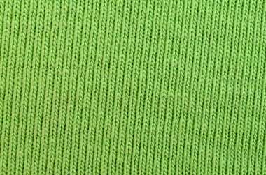 Kumaş dokusuna parlak yeşildir. Gömlek ve bluz yapmak için malzeme