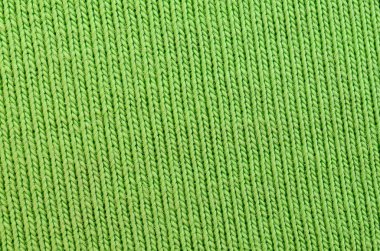 Kumaş dokusuna parlak yeşildir. Gömlek ve bluz yapmak için malzeme