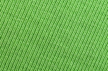 Kumaş dokusuna parlak yeşildir. Gömlek ve bluz yapmak için malzeme
