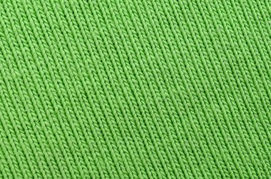 Kumaş dokusuna parlak yeşildir. Gömlek ve bluz yapmak için malzeme