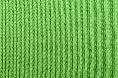 Kumaş dokusuna parlak yeşildir. Gömlek ve bluz yapmak için malzeme