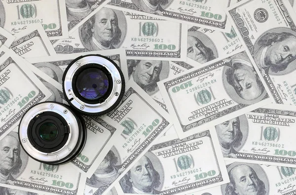 Two Photographic Lenses Lie Background Lot Dollar Bills Space Text — Stock Photo, Image