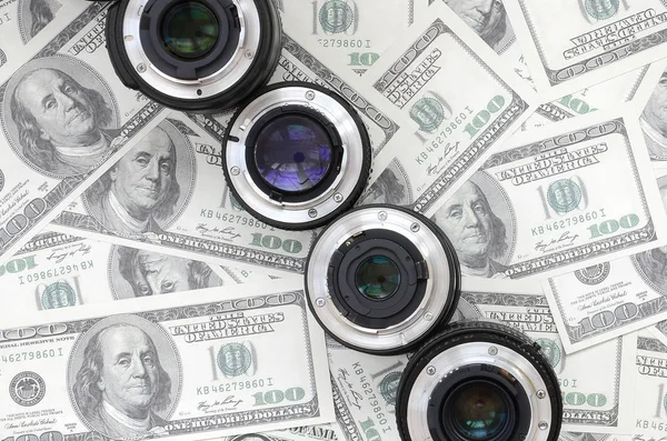 Few Photographic Lenses Lies Background Lot Dollar Bills Space Text — Stock Photo, Image