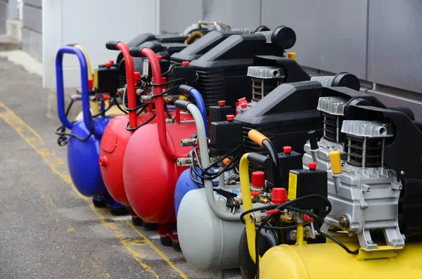 Many new air compressors pressure pumps close up photo — Stock Photo, Image