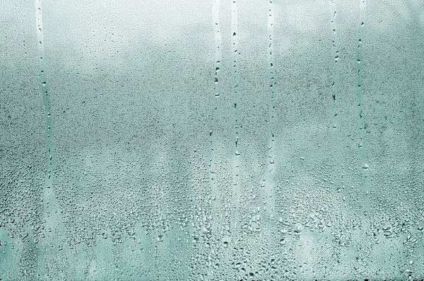 Текстура краплі дощу на склянці мокрий прозорий фон . — стокове фото