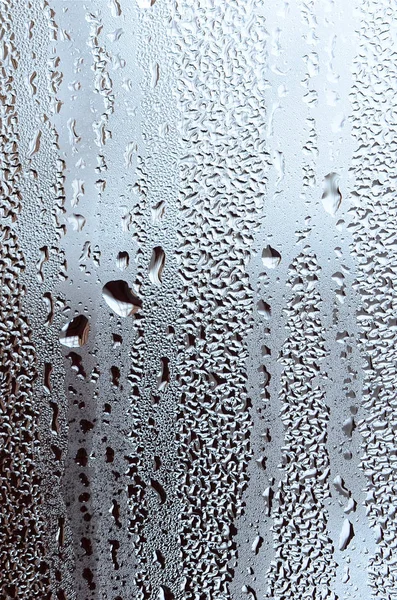 Texture of a drop of rain on a glass wet transparent background. — Stock Photo, Image