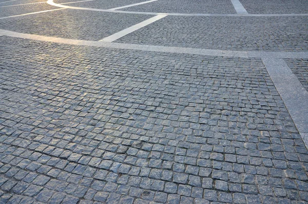 Fragment of the street square, folded out of a gray square paving stone — Stock Image Fragment Street Square Folded Out Gray Square Paving Stone Royalty Free Stock Images