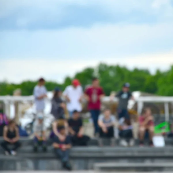 Defocused image of a lot of people with bmx bikes. Meeting of fans of extreme sports