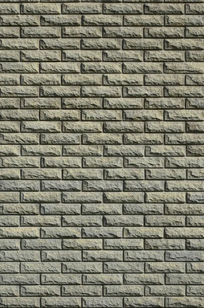 The texture of the wall is made of modern relief brown brick. Background image