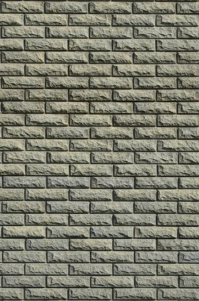 The texture of the wall is made of modern relief brown brick. Background image