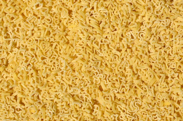 Tekstura Sporo Kręconych Surowego Makaronu Żółty — Zdjęcie stockowe