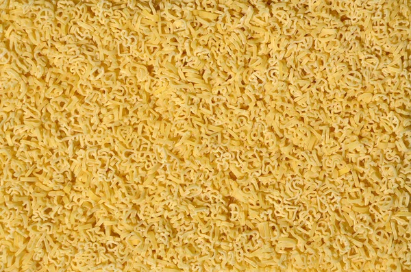 Texture Lot Curly Raw Yellow Pasta — Stock Photo, Image