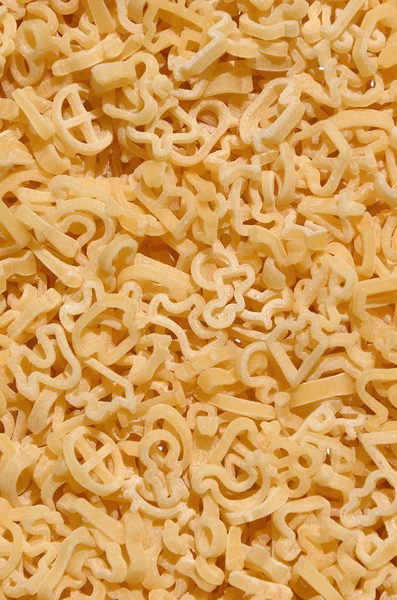 Textura Una Gran Cantidad Pasta Rizada Color Amarillo Crudo — Foto de Stock