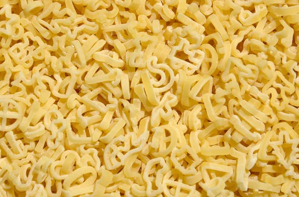 Texture Lot Curly Raw Yellow Pasta — Stock Photo, Image