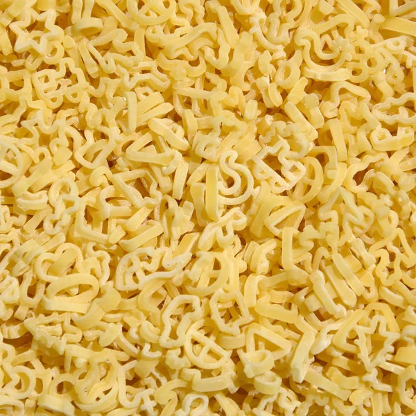 Textura Una Gran Cantidad Pasta Rizada Color Amarillo Crudo — Foto de Stock