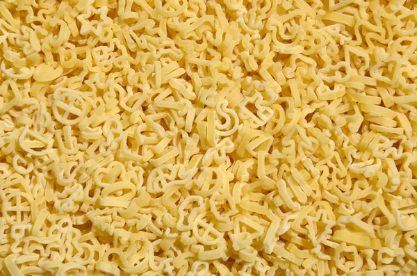 Textura Una Gran Cantidad Pasta Rizada Color Amarillo Crudo — Foto de Stock