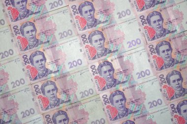 Bir close-up desenle 200 hryvnia par değeri birçok Ukrayna para birimi banknotlar. Arka plan resmi iş Ukrayna