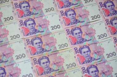 Bir close-up desenle 200 hryvnia par değeri birçok Ukrayna para birimi banknotlar. Arka plan resmi iş Ukrayna