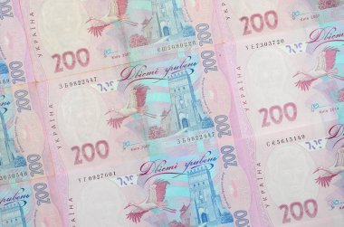 Bir close-up desenle 200 hryvnia par değeri birçok Ukrayna para birimi banknotlar. Arka plan resmi iş Ukrayna