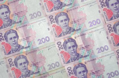 Bir close-up desenle 200 hryvnia par değeri birçok Ukrayna para birimi banknotlar. Arka plan resmi iş Ukrayna