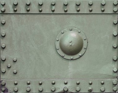 Metalden yapılmış ve çok sayıda ile takviyeli tank Duvar dokusu cıvata ve perçin. İkinci Dünya Savaşı savaş bir araçtan kapsayan görüntüleri