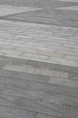 Parlak güneş ışığı altında platformlar Meydanı çeşitli fayans parke granit doku şeklinde