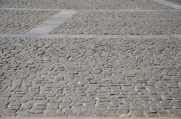 Textura Losa Pavimentación Adoquines Muchas Piedras Pequeñas Forma Cuadrada Bajo —  Fotos de Stock