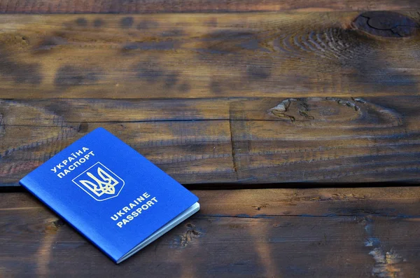 Photo Ukrainian Foreign Passport Lying Dark Wooden Surface Concept Introducing — Stock Photo, Image
