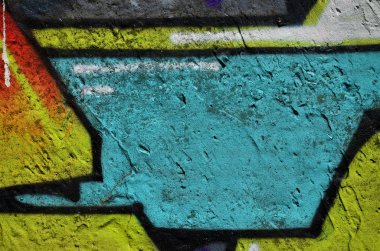 Arka plan resmi duvarın renkli soyut grafiti ile dekore edilmiştir. Sokak sanatı kavramı