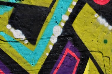 Arka plan resmi duvarın renkli soyut grafiti ile dekore edilmiştir. Sokak sanatı kavramı