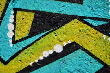 Arka plan resmi duvarın renkli soyut grafiti ile dekore edilmiştir. Sokak sanatı kavramı