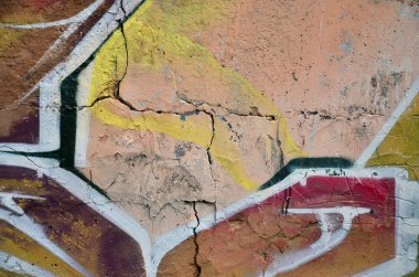 Sokak sanatı. Duvarda renkli bir duvar yazısı var. Arka plan için parça. Bir duvar yazısının soyut ayrıntıları