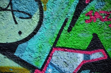 Arka plan resmi duvarın renkli soyut grafiti ile dekore edilmiştir. Sokak sanatı kavramı