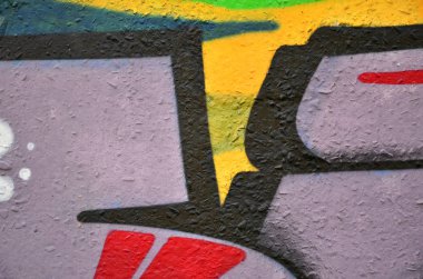 Arka plan resmi duvarın renkli soyut grafiti ile dekore edilmiştir. Sokak sanatı kavramı